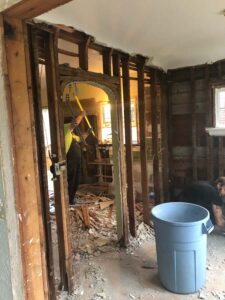 Workers renovating interior of an old house