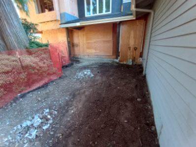 Narrow alley beside house under construction