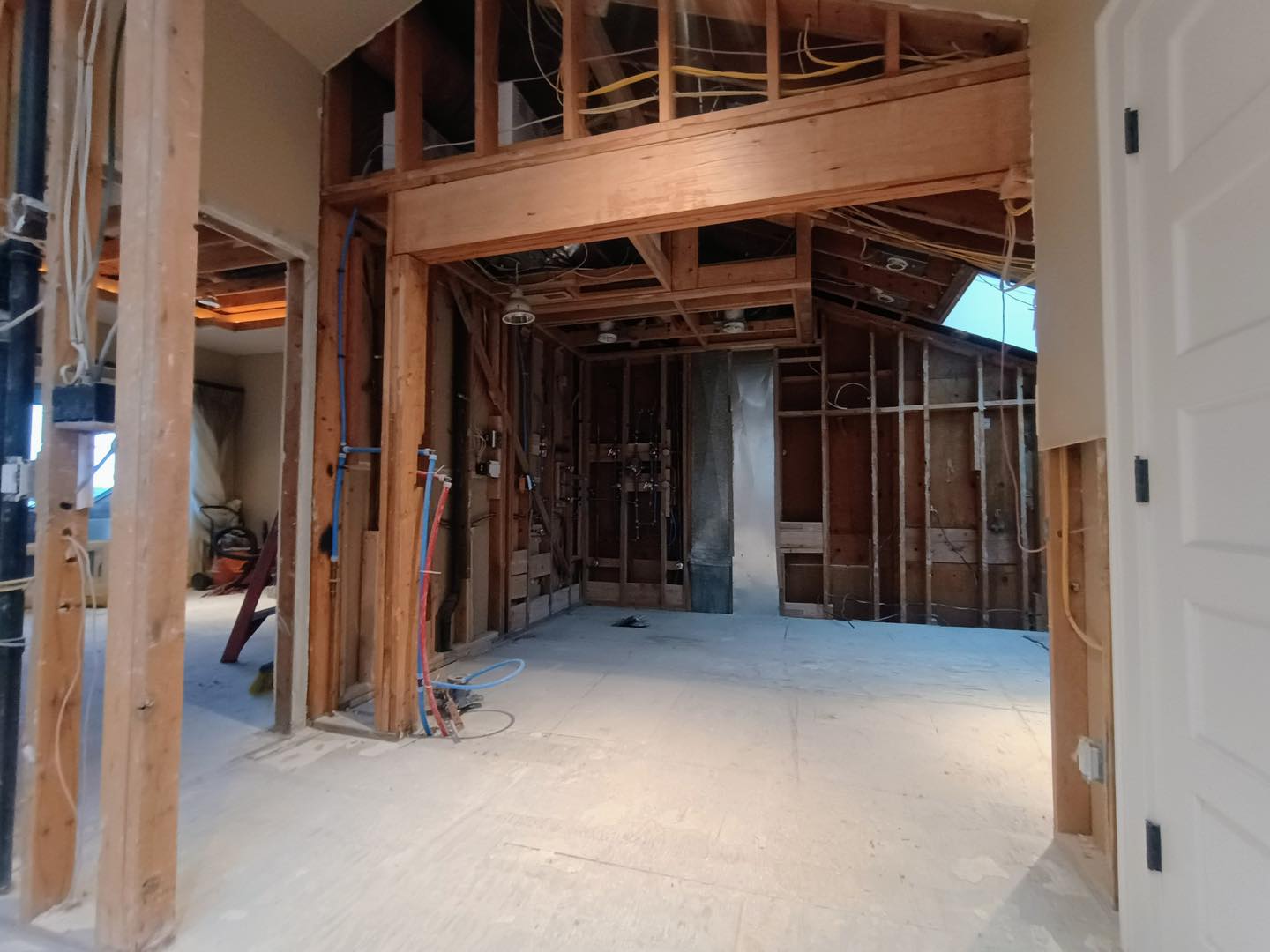 Interior construction of house with exposed wooden framing