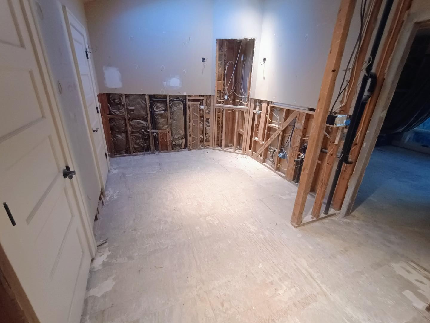 Interior room under renovation showing exposed walls